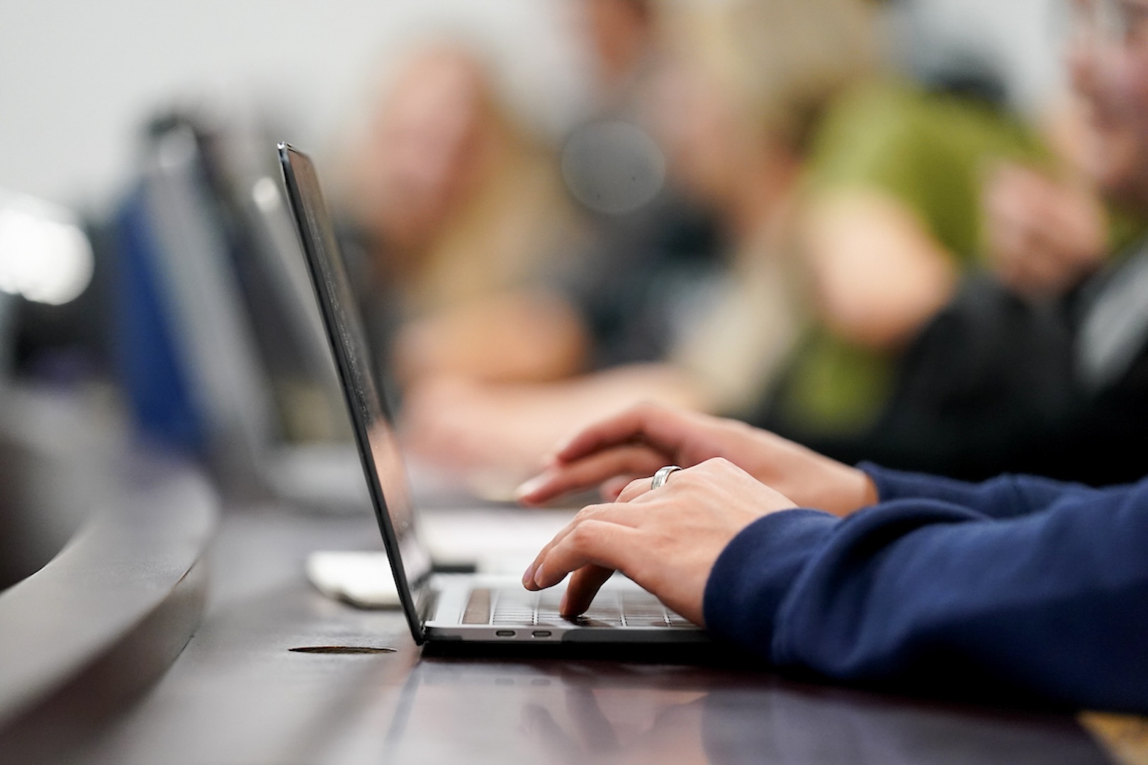 hand typing on laptop