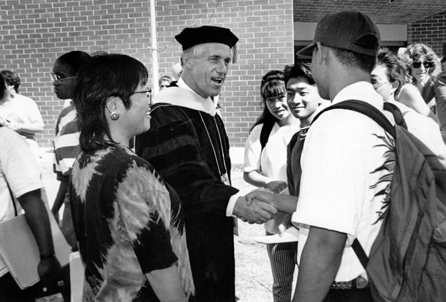 President Welty Shaking Student's Hands
