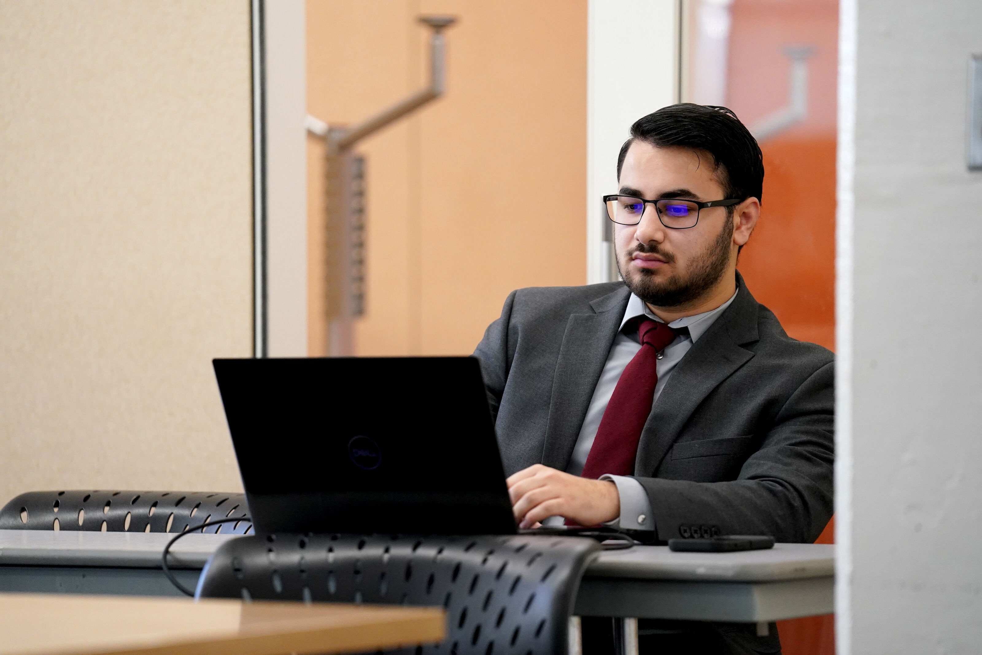 Pillar 1. Person working on their laptop